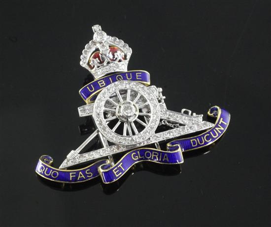 An early/mid 20th century gold and platinum, two colour enamel and diamond set Royal Artillery regimental sweethearts brooch, 42mm.